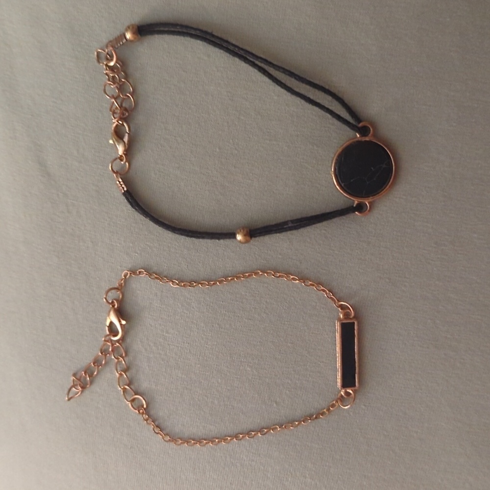 Set of two gold and black bracelets